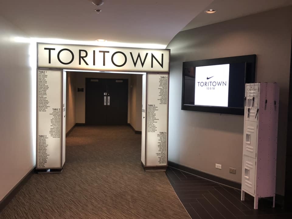 A hallway with a sign that says toritown on it