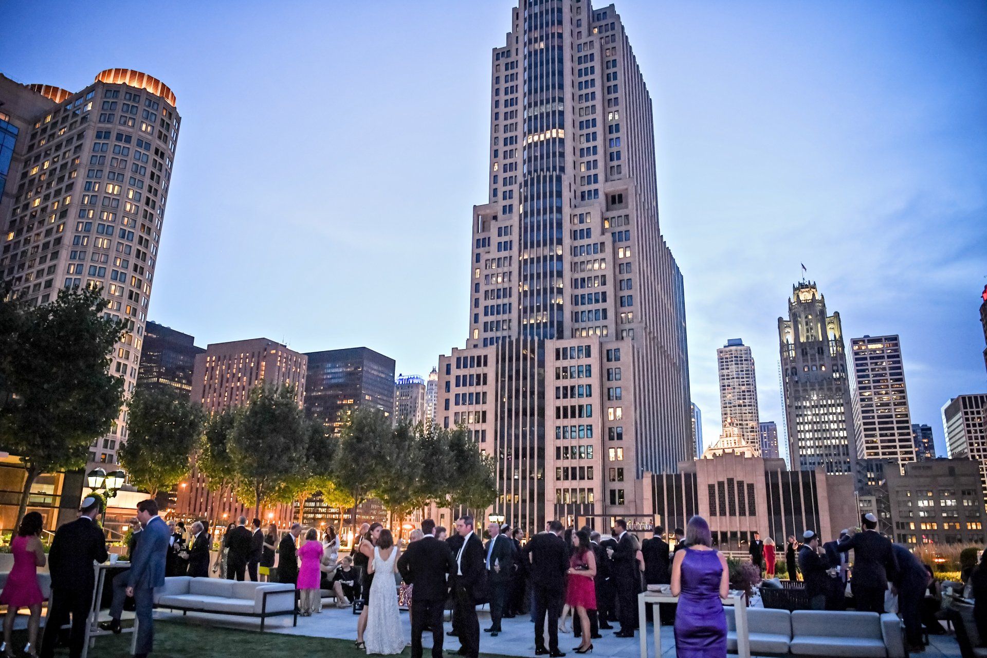 A group of people standing in front of a tall building