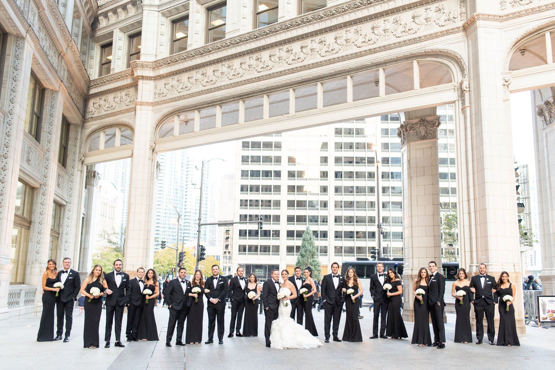 A large group of people are posing for a picture in front of a building.