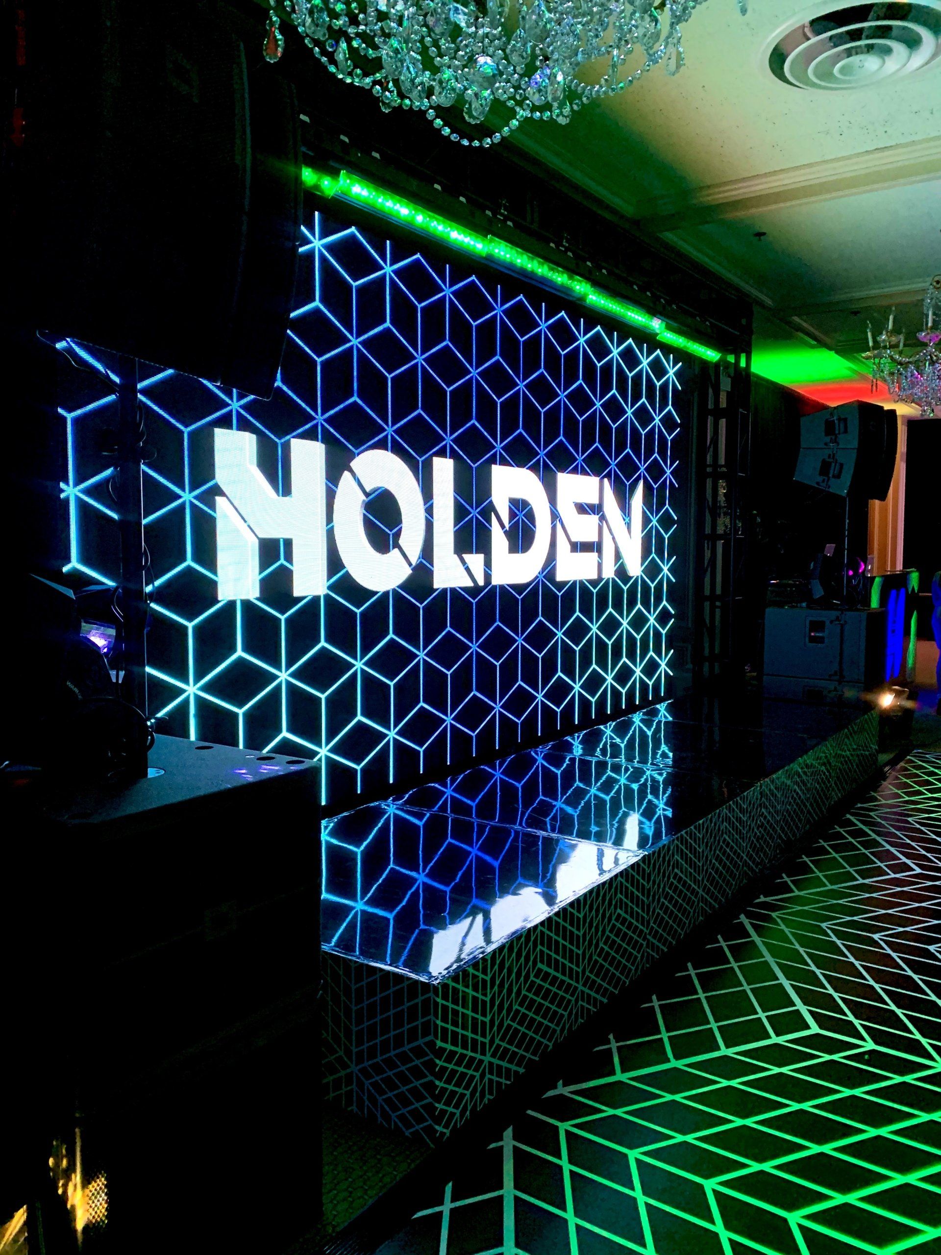 A wall with the word holden on it
