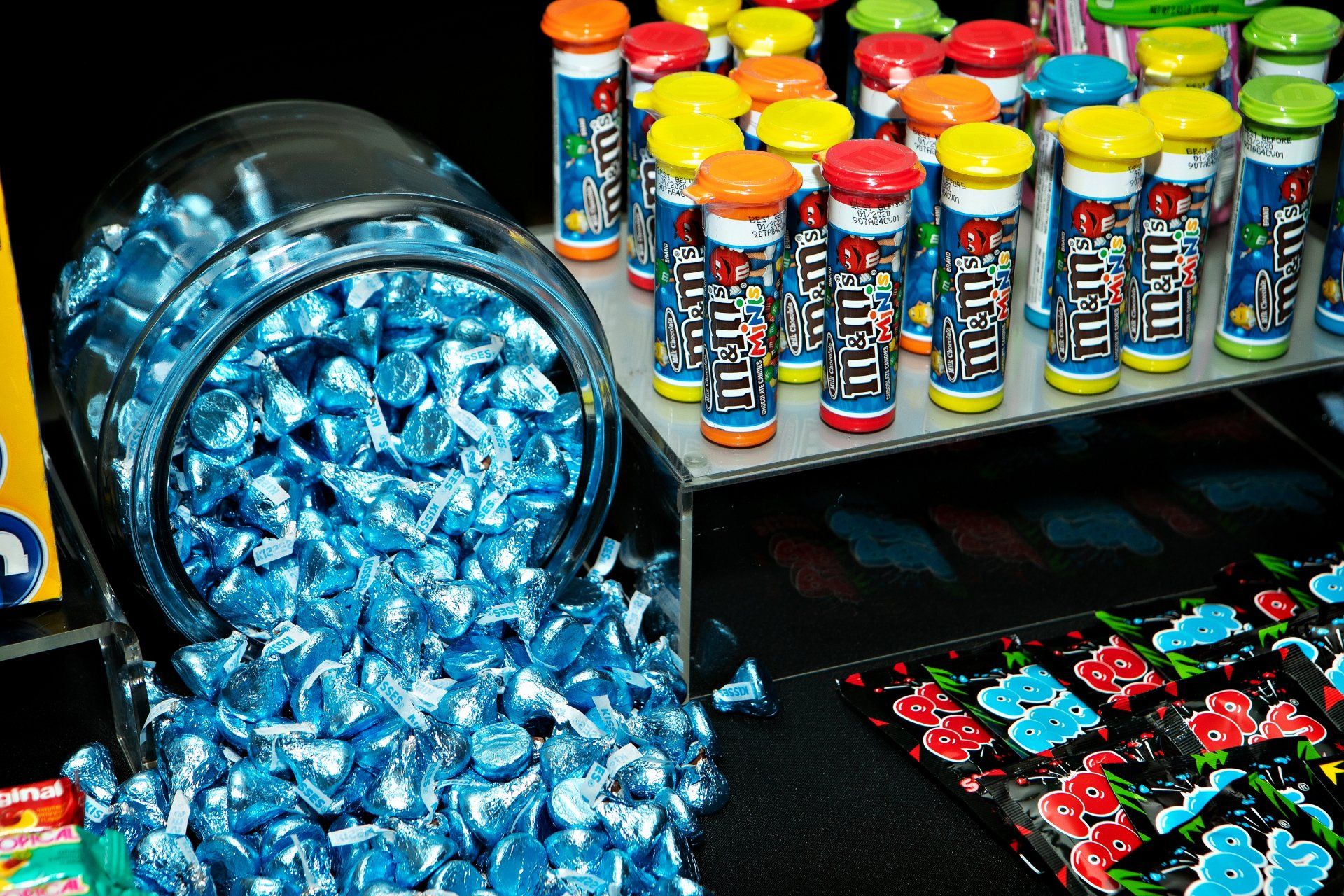 A jar of m & m 's is filled with blue candies
