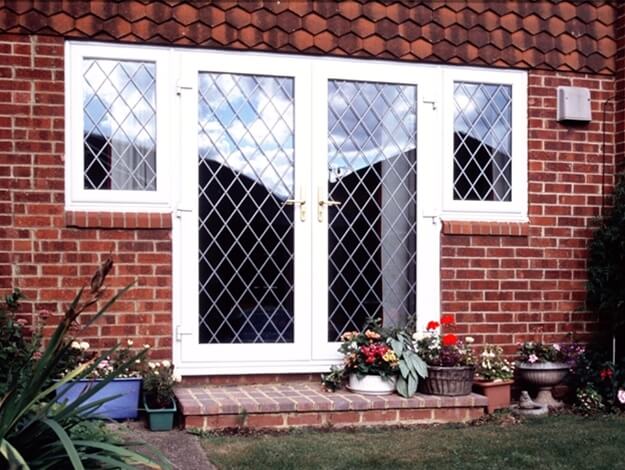 A brick house with a white door and window