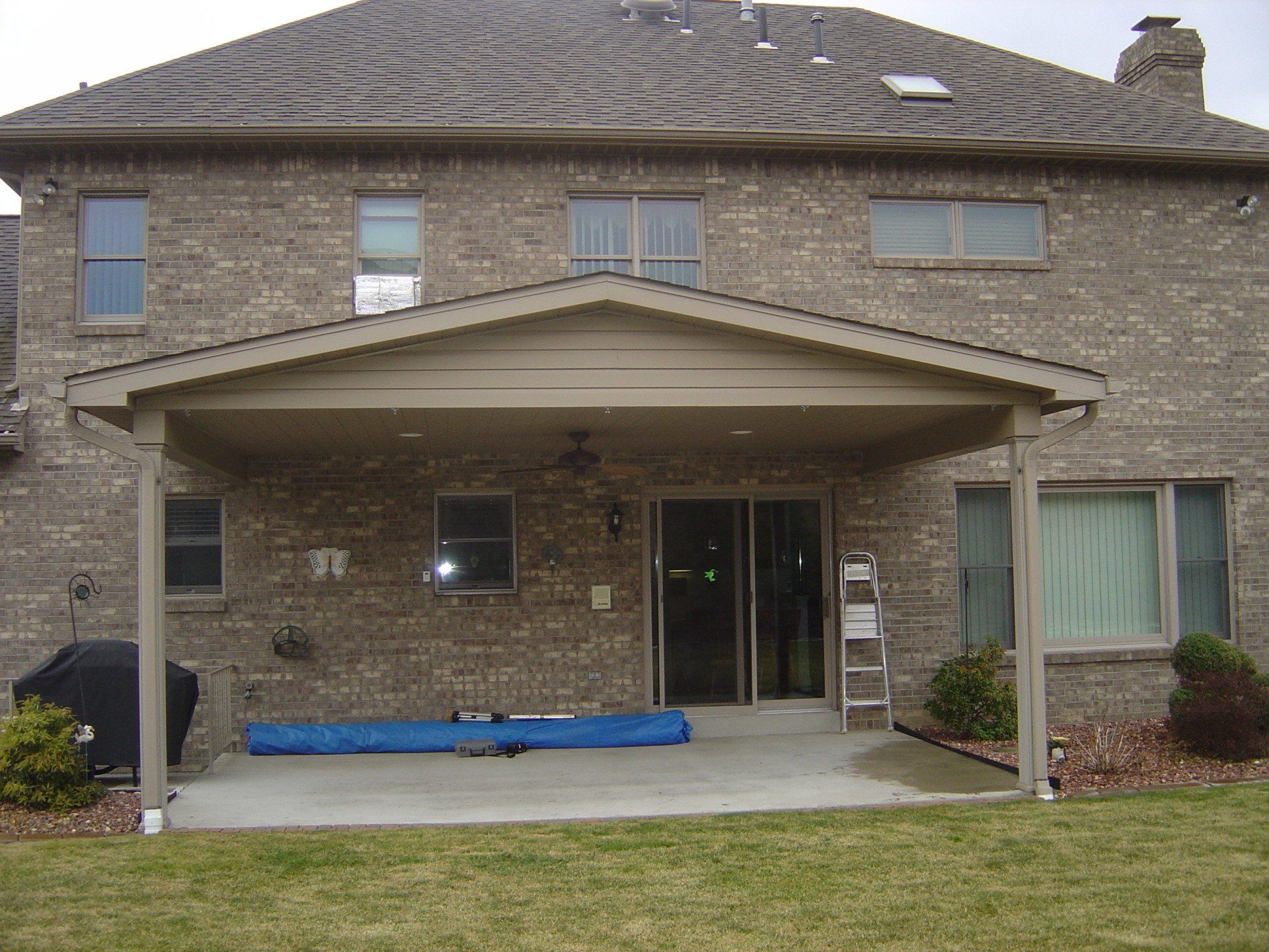 slider show a before picture and after picture of a porch enclosure built by Betterliving Patio Rooms of Pittsburgh