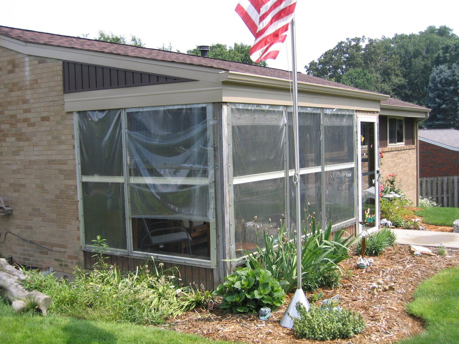 before photograph of an old porch enclosure