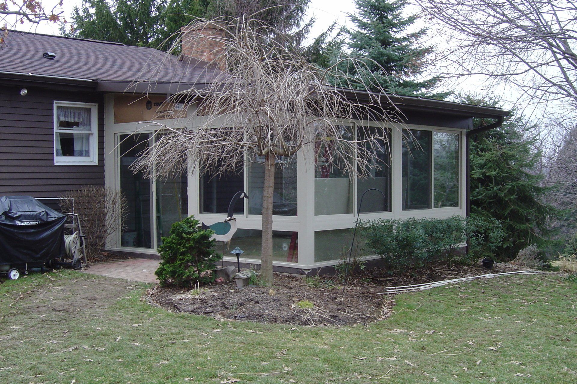  slider showing a before picture and after picture of a porch enclosure built by Betterliving Patio Rooms of Pittsburgh