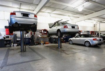 vehicles in an auto shop