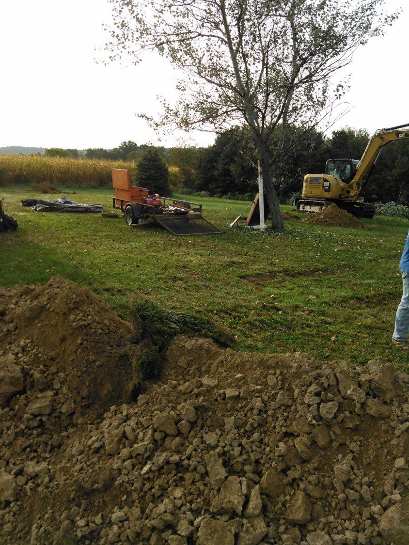 Excavate — Backhoe Starting The Job in Slippery Rock, PA