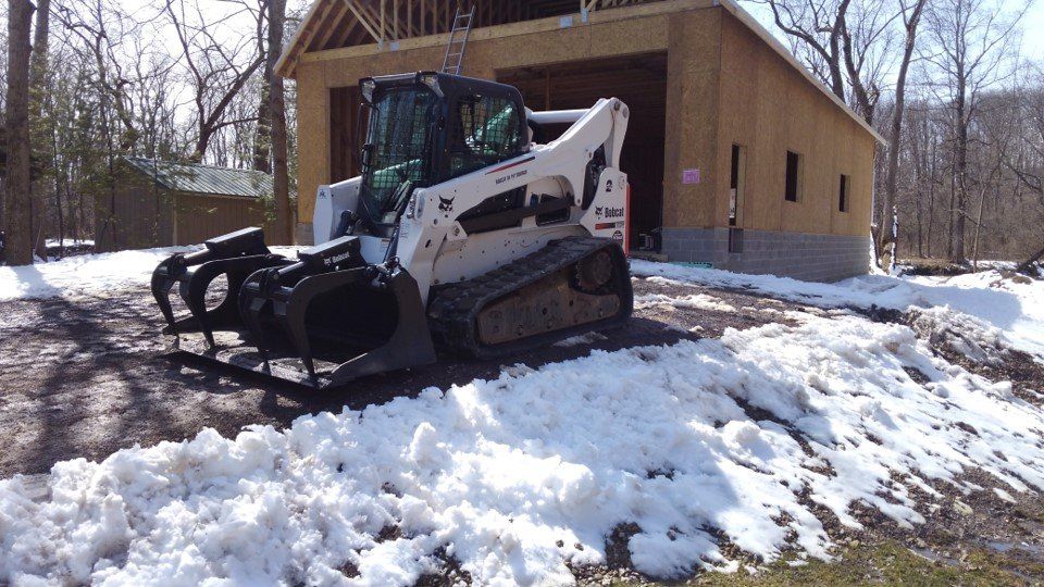 Snow Service — White Loader Park With Snow in Slippery Rock, PA