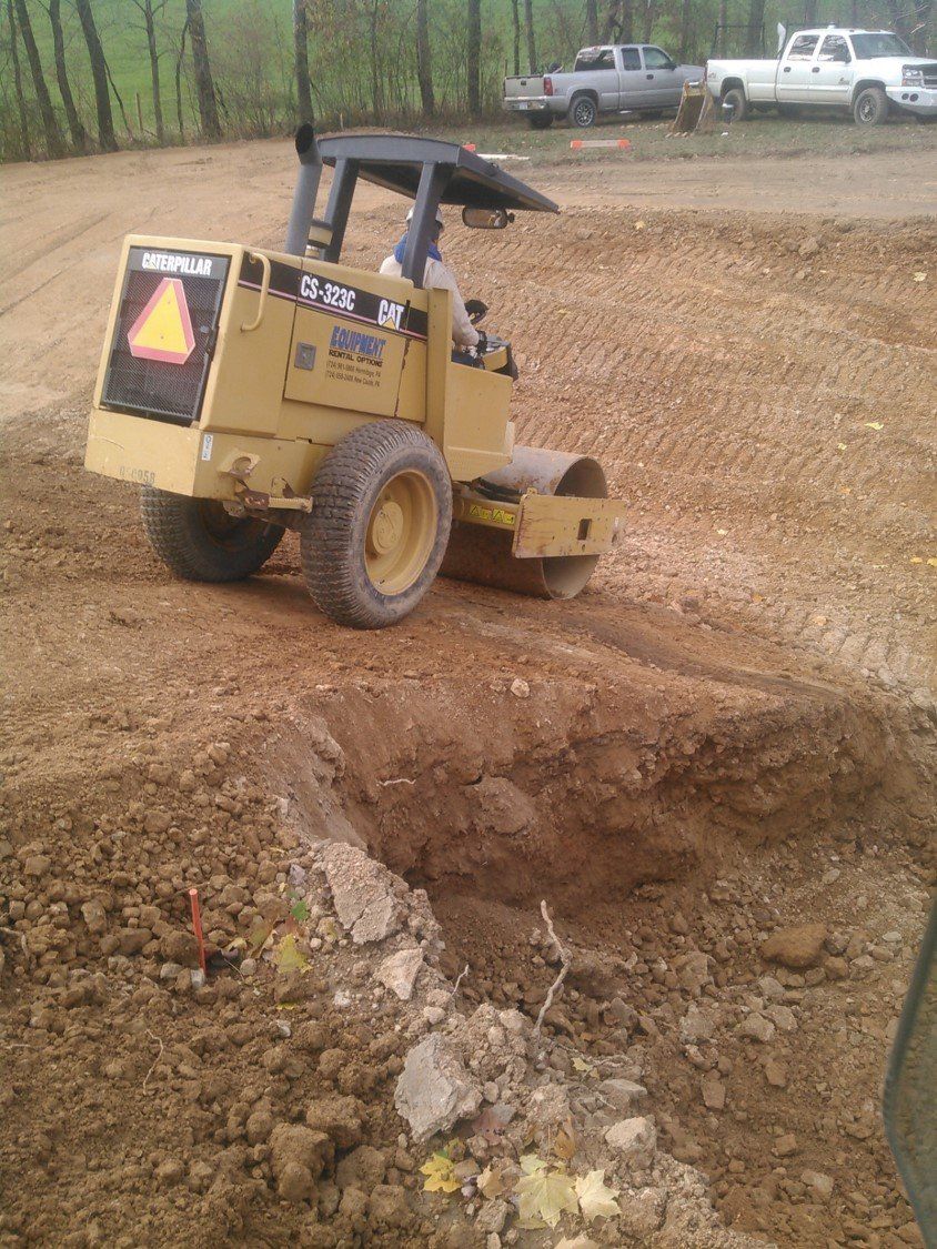Sand Mound — Roller Flattening The Soil in Slippery Rock, PA