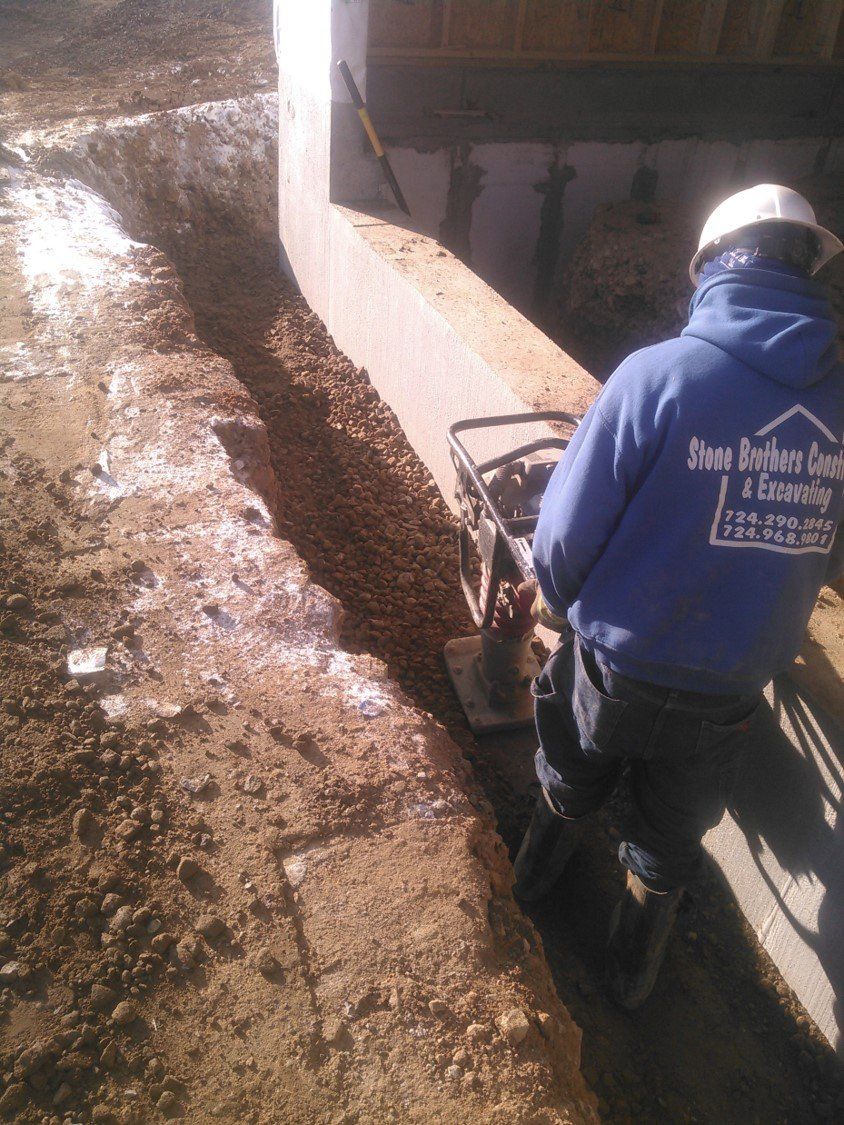 Compactor — Man Using Compactor To Flatten The Soil in Slippery Rock, PA