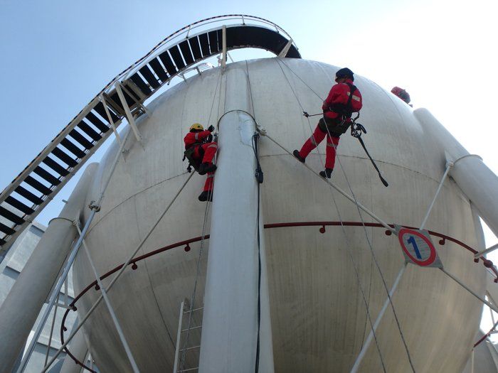 Man Inspecting with Rope