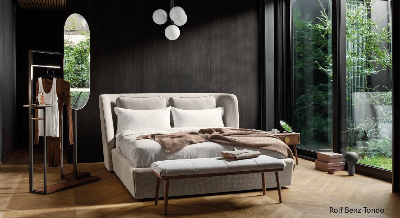 The Rolf Benz Tondo Bed in cream fabric with the  917  Bench, 916 Bedside unit  and the 907 Valet stand