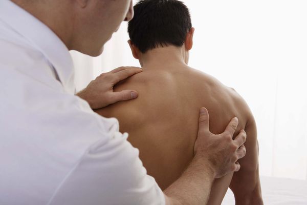Chiropractor works on spine alignment with a patient in Florence, KY
