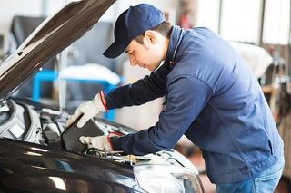 Mechanic changing oil in a car engine - repair in Worcester, MA Mechanic changing oil in a car engine - repair in Worcester, MA