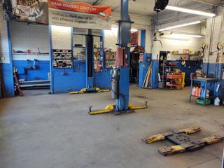 Mechanic changing oil in a car engine - repair in Worcester, MA Mechanic changing oil in a car engine - repair in Worcester, MA