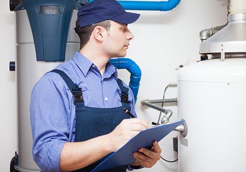 Our employee doing hot water heater repair service in Enterprise, AL