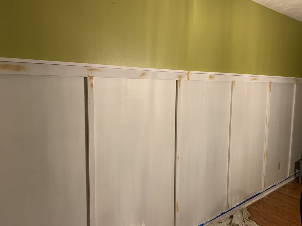 Caulk and wood putty on board and batten