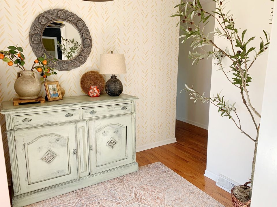 faux olive tree in foyer