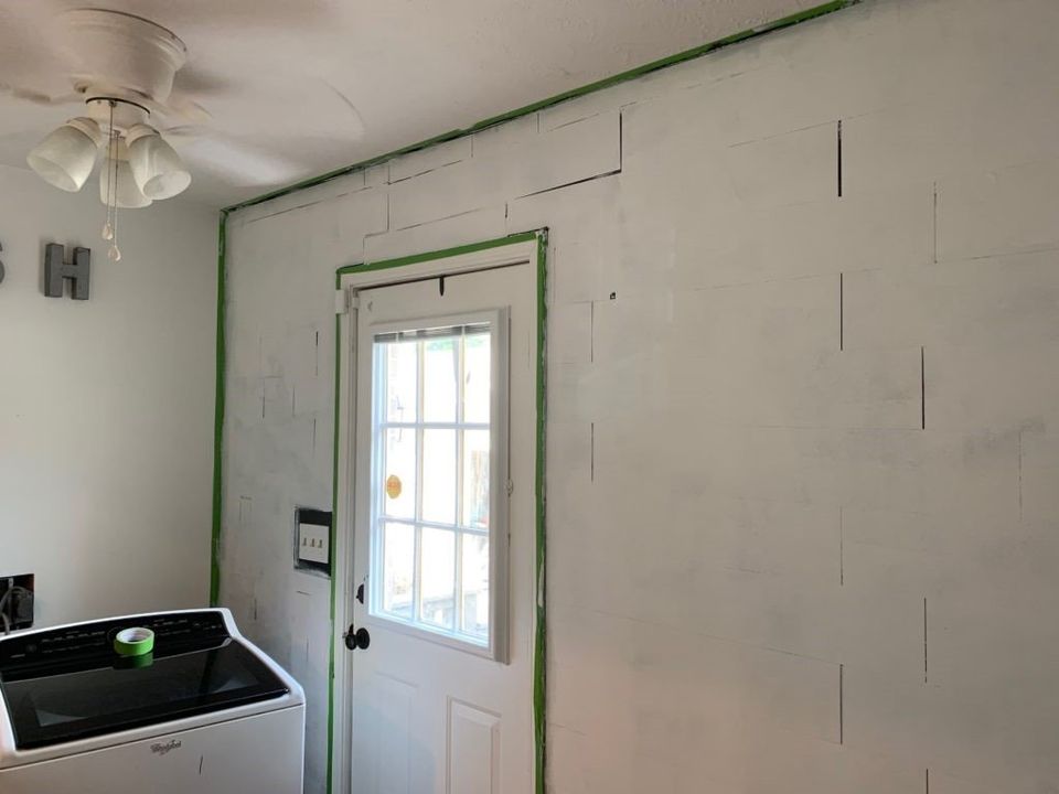 primed faux vinyl shiplap wall