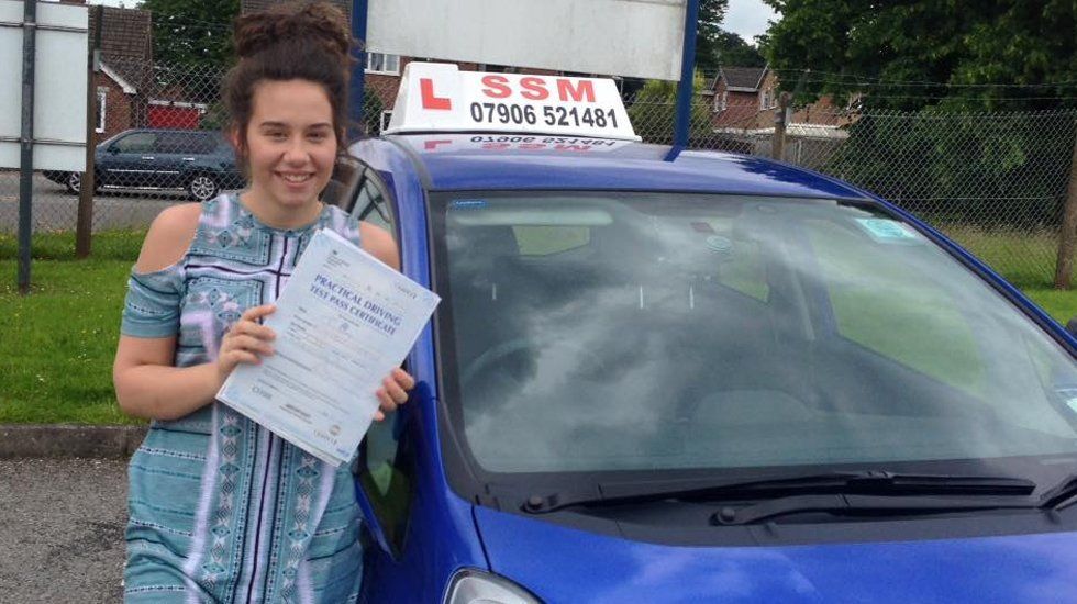 A lady passing the driving test