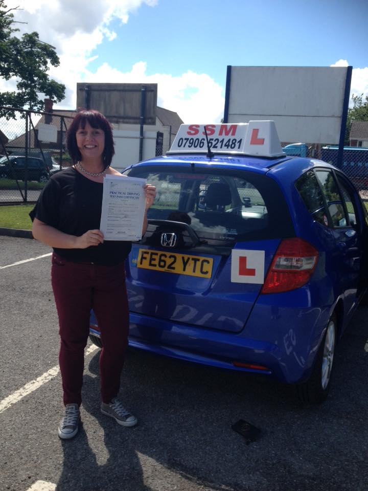A woman passing the driving test