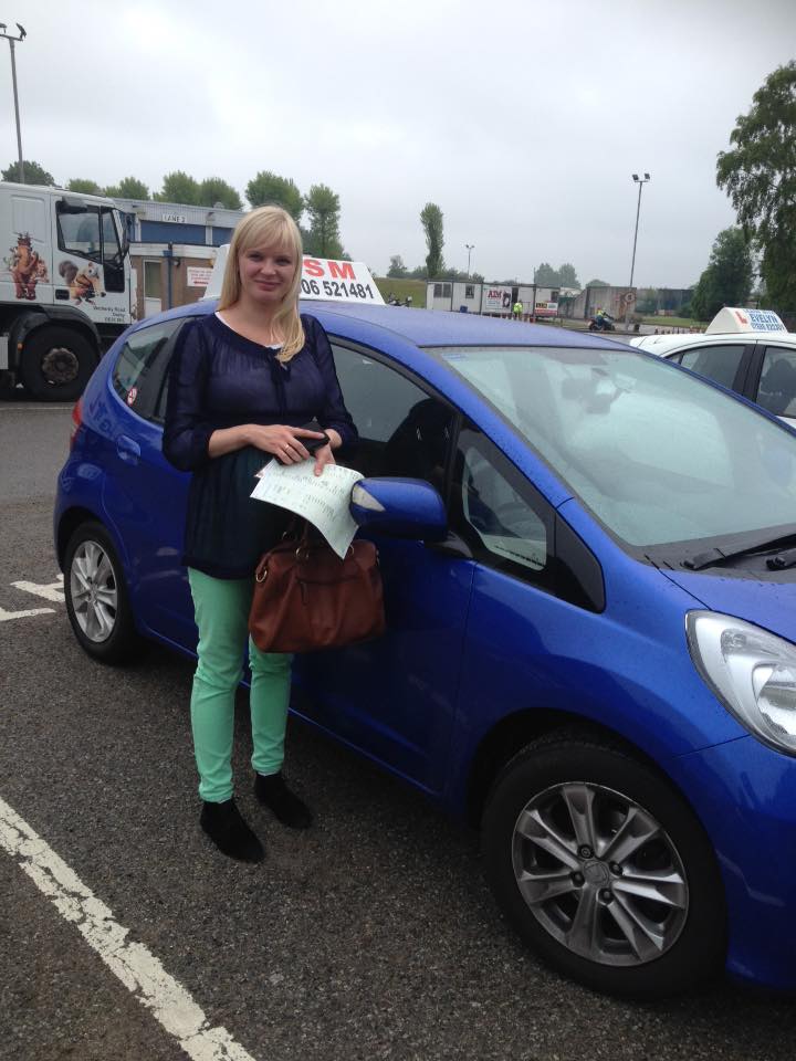 A woman passing the driving test