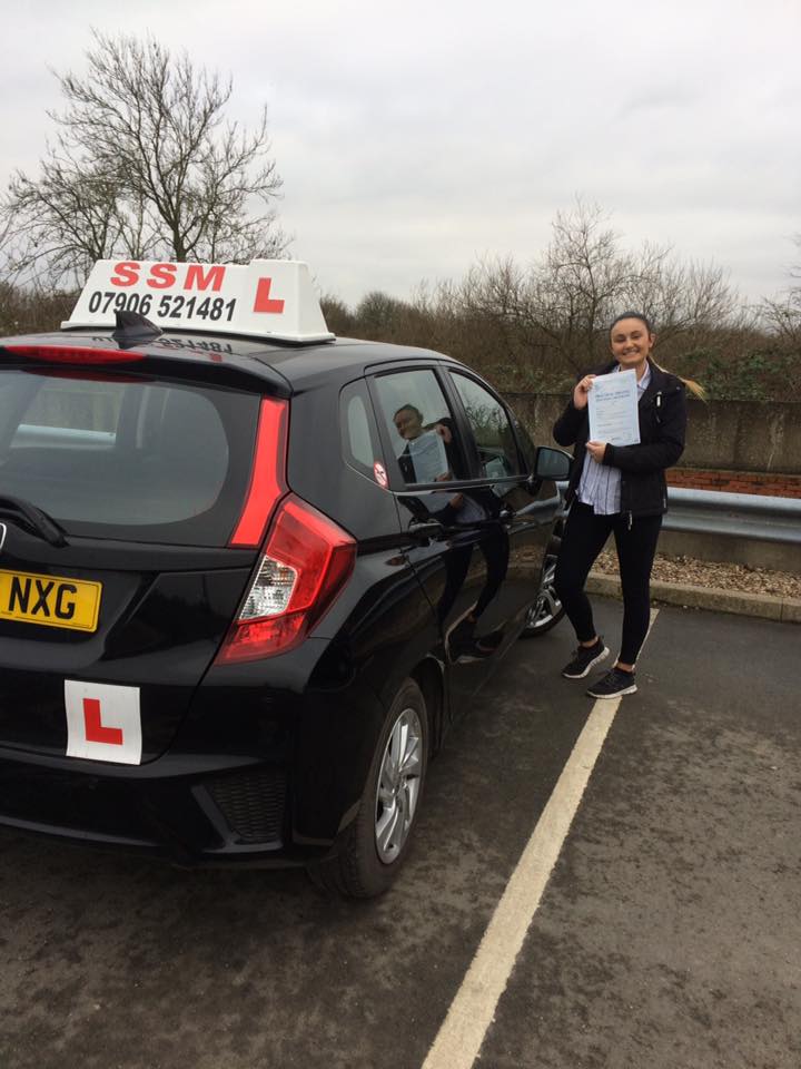 A woman passing the driving test