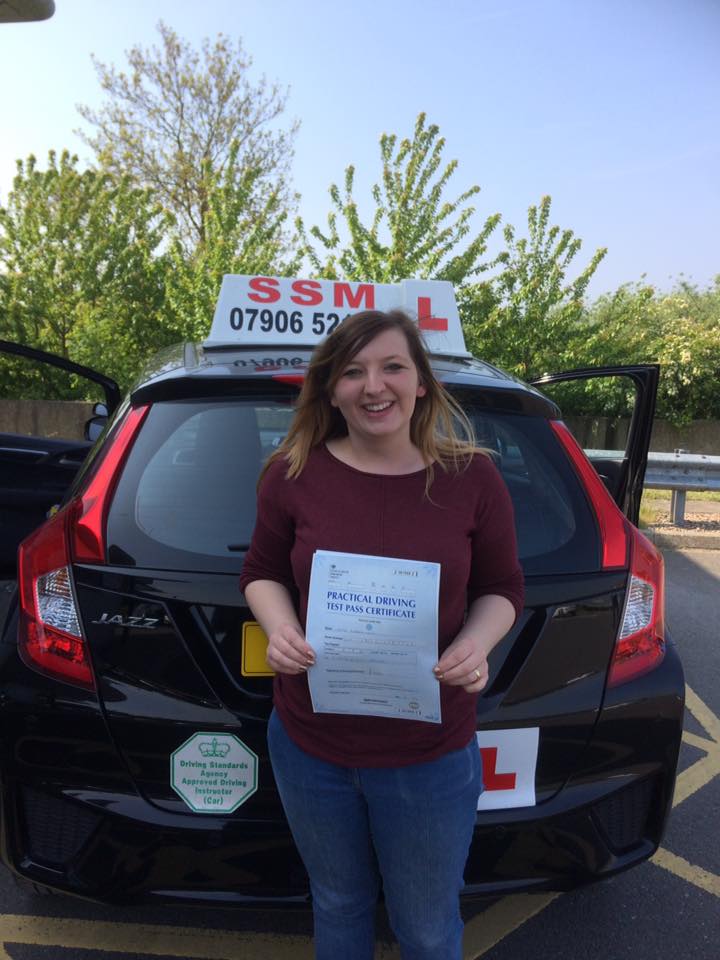 A woman passing the driving test