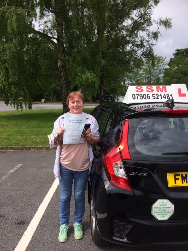 A woman passing the driving test
