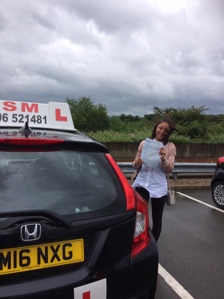 A woman passing the driving test