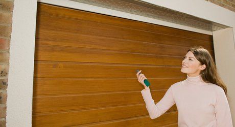 a lady operating garage door