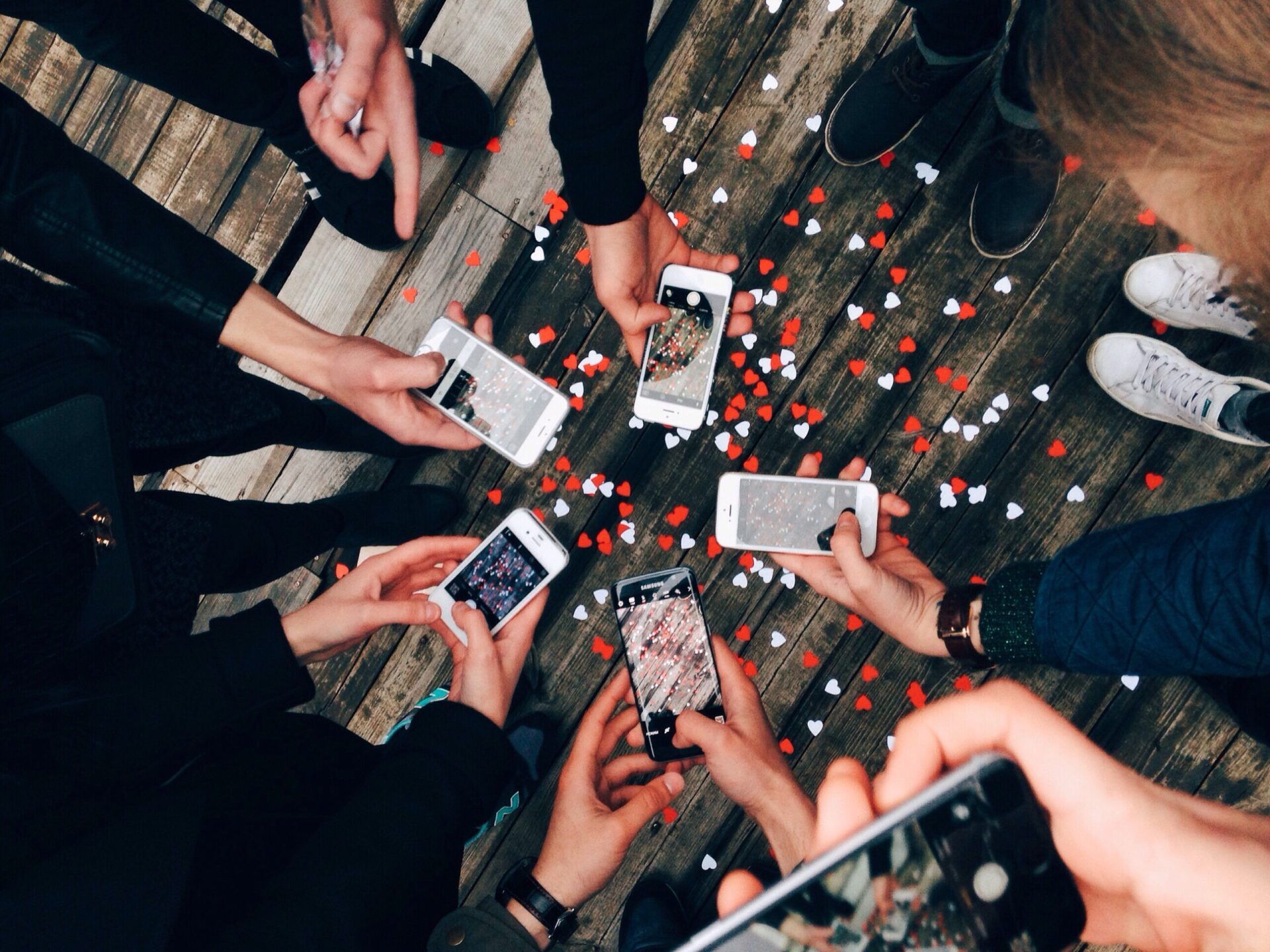 Residents taking pictures with their phone | 5 Tips for Reposting Resident Content on Social Media