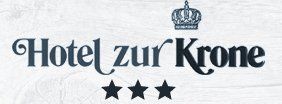 Ein Logo für das Hotel Zur Krone mit einer Krone und drei Sternen
