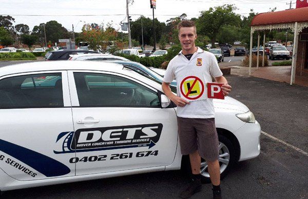 young man with new car license
