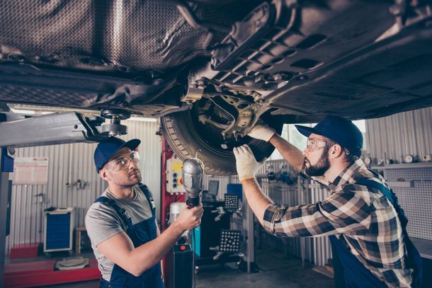 Checking Under Car — St. Charles, MO — Lindenwood Auto Service Checking Under Car — St. Charles, MO — Lindenwood Auto Service