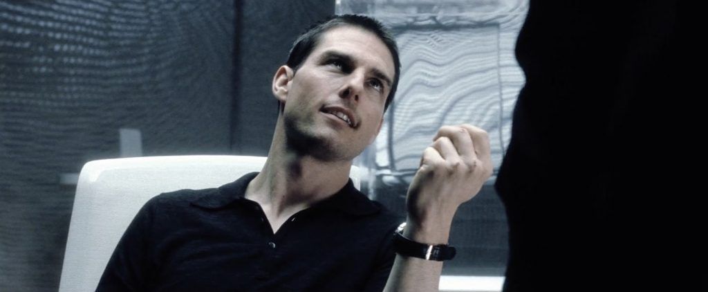 A man in a black shirt is sitting in a chair