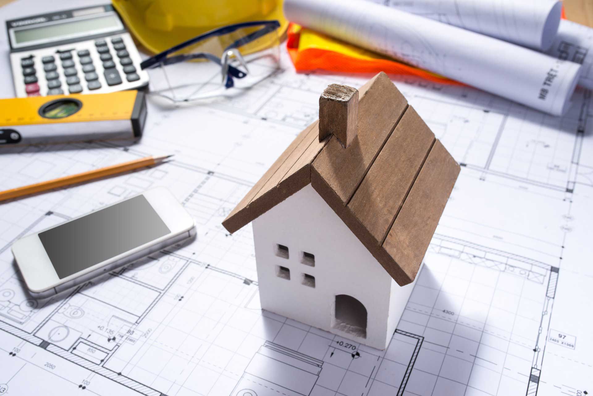 Timber House Model Sitting On Construction Plan — River City Certifiers in Taree NSW