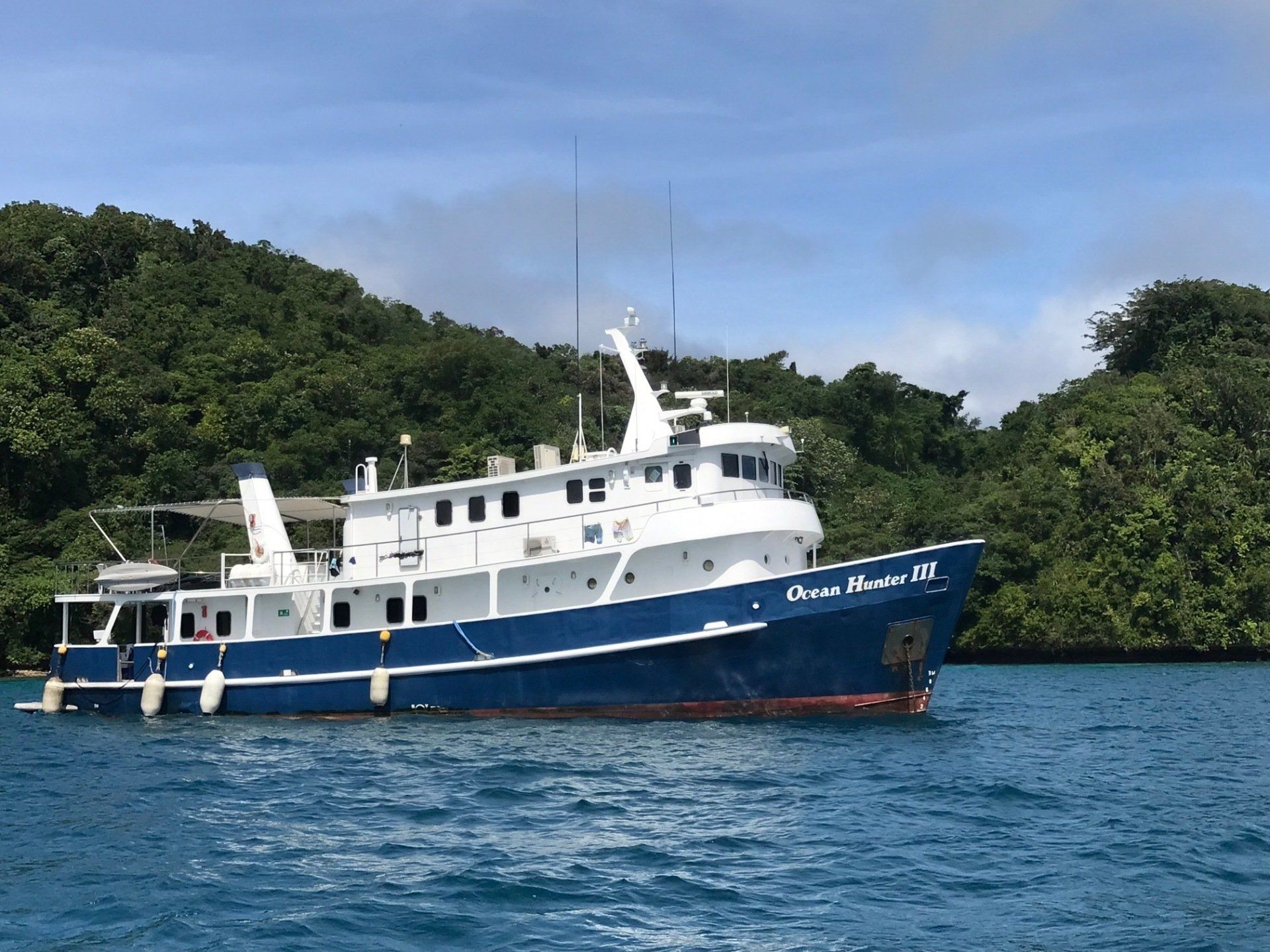 Blue and white boat named