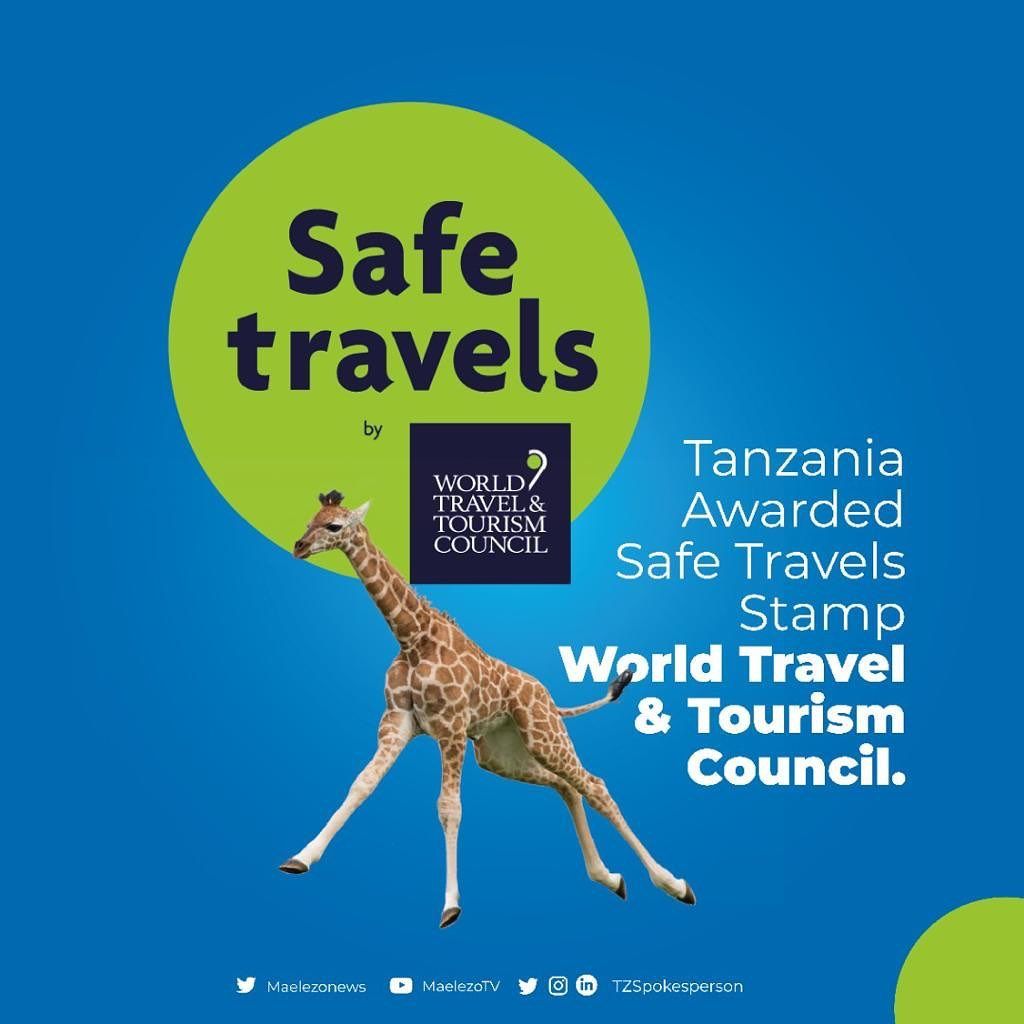 Tanzania awarded Safe Travels Stamp by the World Travel & Tourism Council; features a giraffe against a blue background.