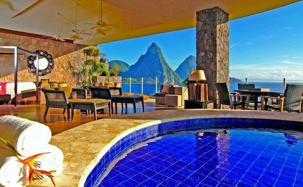 Pool overlooking ocean and Pitons mountains in St. Lucia.