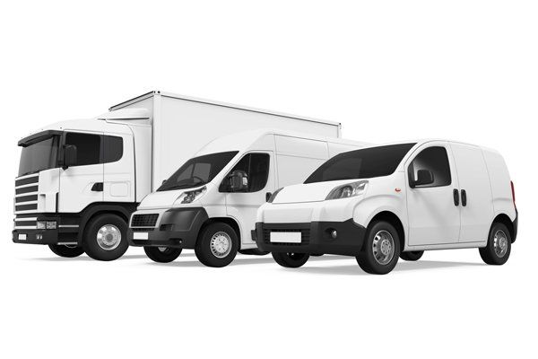 Fleet of white cars vans and trucks