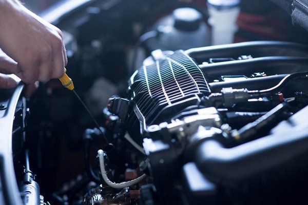 Mechanic working on a car engine