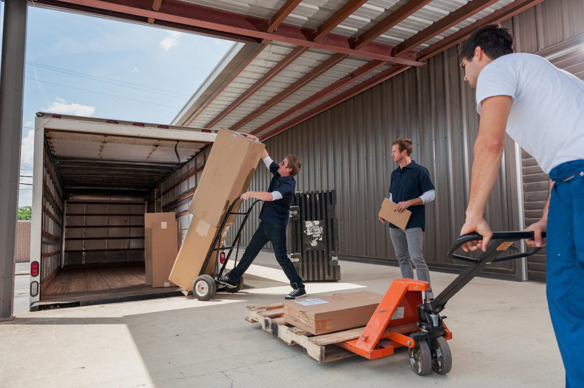 Workers Loading A Delivery Truck — Minneapolis, MN — Bester Bros Transfer & Storage Co