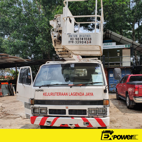 White utility truck with lift boom parked outdoors, labeled “Kejuruteraan Lagenda Jaya.”