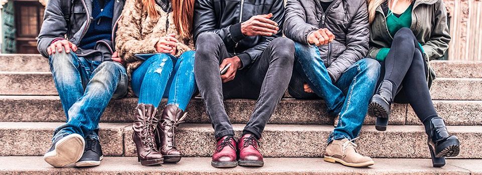 Diverse group of students sitting on stairs | Red Brick Property Management LLC