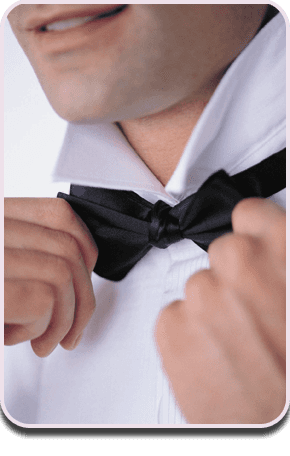 Man knotting bow tie