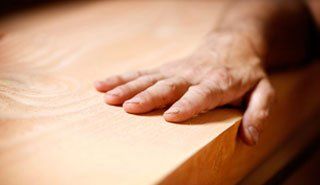 Home Refurbishment - Horsham, West Sussex - G Aldridge Co - Hand touching a piece of wood