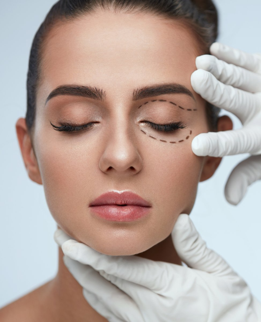 Close-up of a woman receiving an eyelid cosmetic procedure with gloved hands