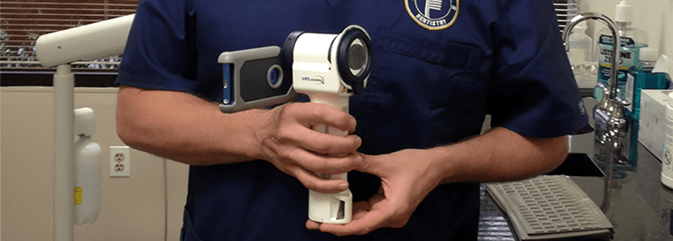Columbia MD Dentist Dr. Daniel Stewart with the VELscope® Vx