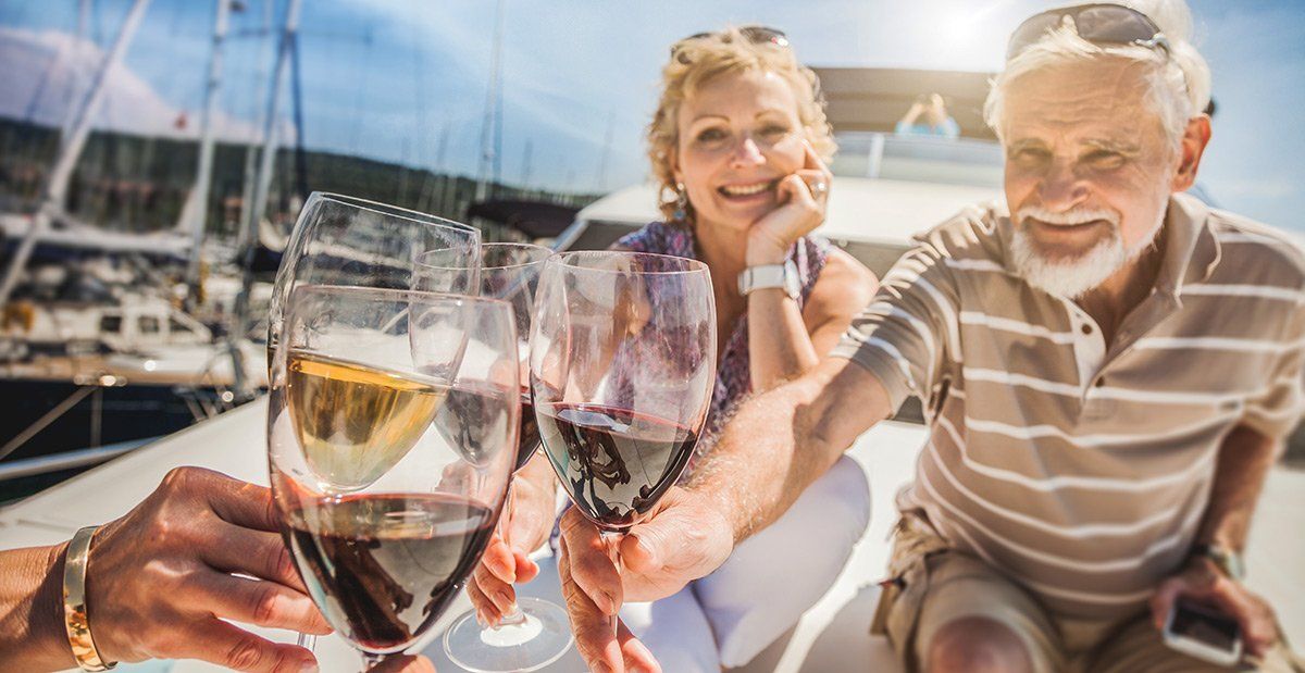 elder couple drinking wine